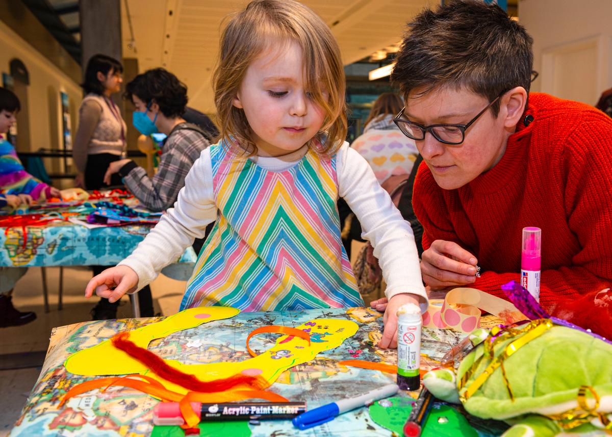 A child takes part in a family craft activity during Out at Sea, an LGBTQ+ History Month event at the National Maritime Museum (T0892-023)