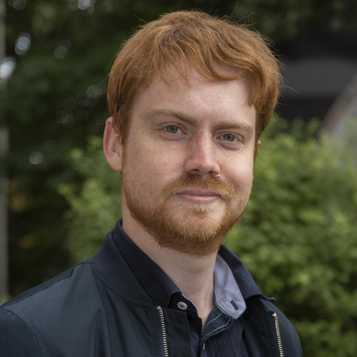 A profile photo of Royal Observatory Greenwich astronomer Dr Greg Brown