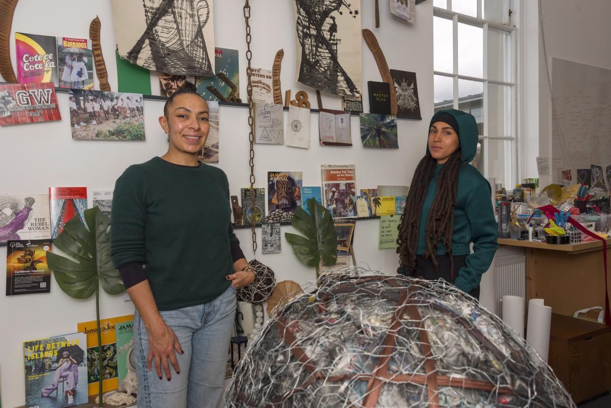 Photo of two people standing in a workshop
