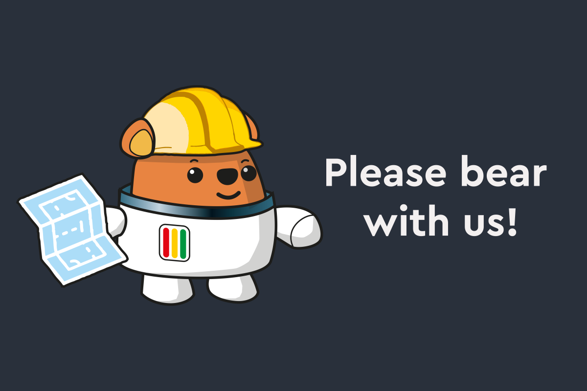 Ted wearing a hard hat and holding a blueprint with the text "Please Bear with us!"