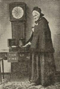 Image of Victorian woman next to grandfather clock