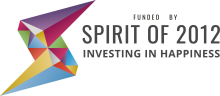 Spirit of 2012 logo, featuring a lightning bolt motif on the left and the words 'Funded by Spirit of 2012: Investing in Happiness' on the right