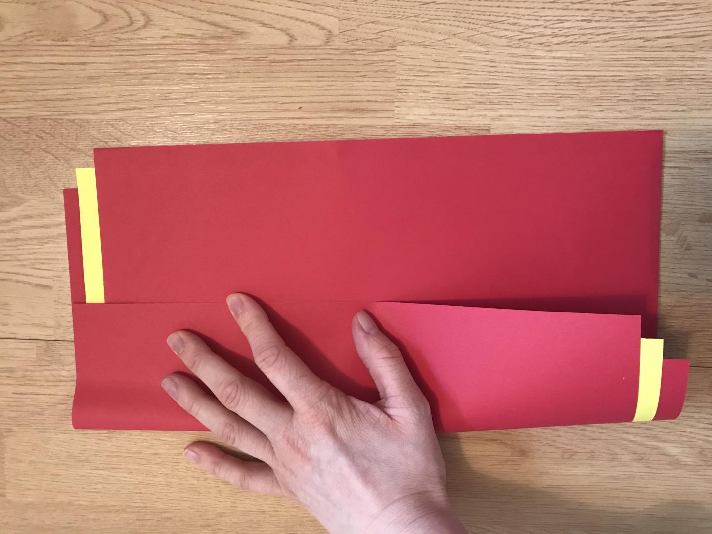 Fold along the long edge