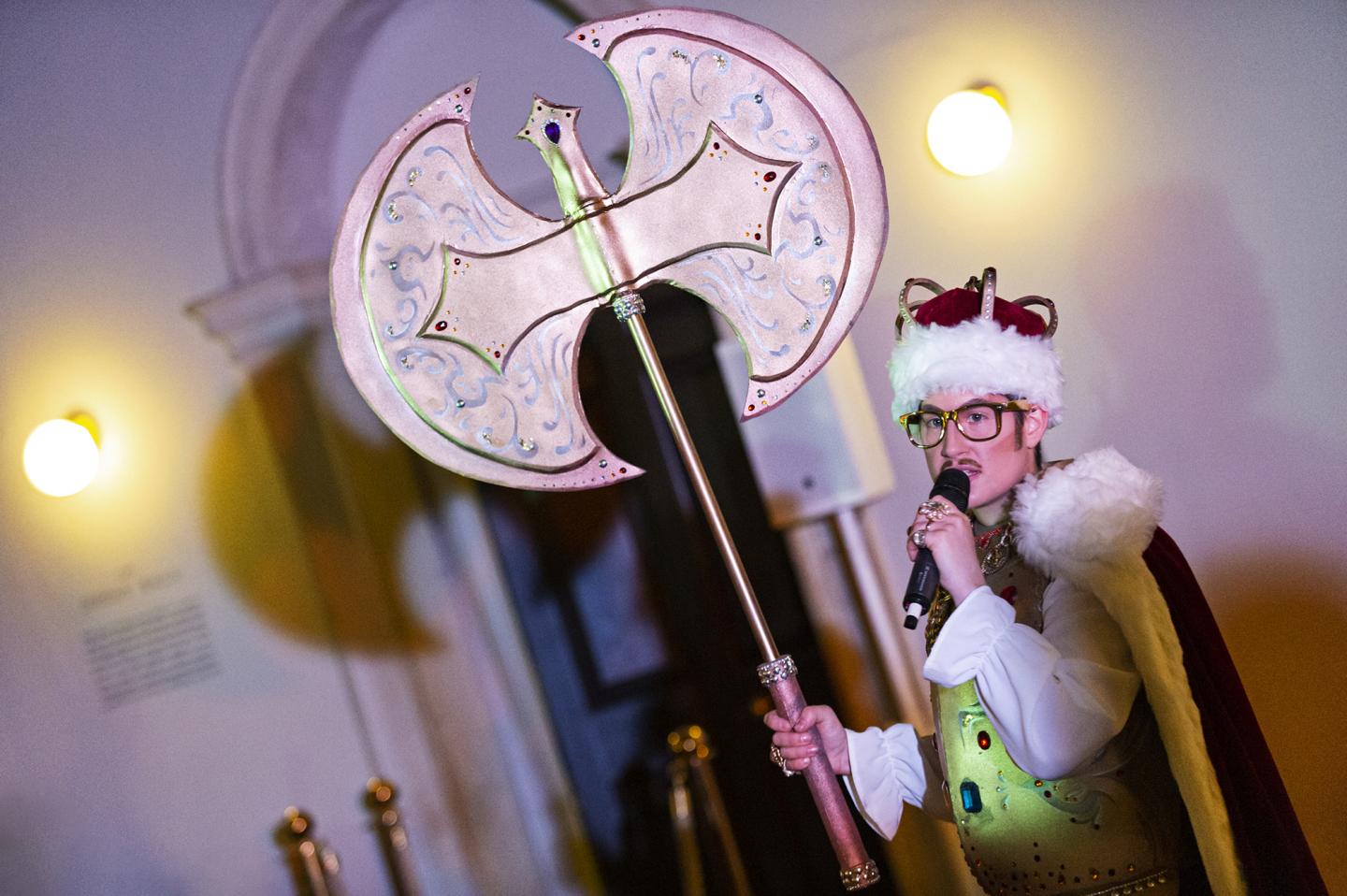 Drag king Adam All holds a huge novelty sledgehammer while performing at the Queen's House