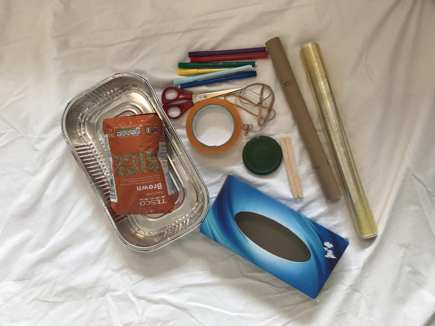 foil container, Scissors  Sellotape,  clingfilm, Rice, Pencil,  Elastic bands, tissue box and cardboard tube, lollypop sticks and coloured pens