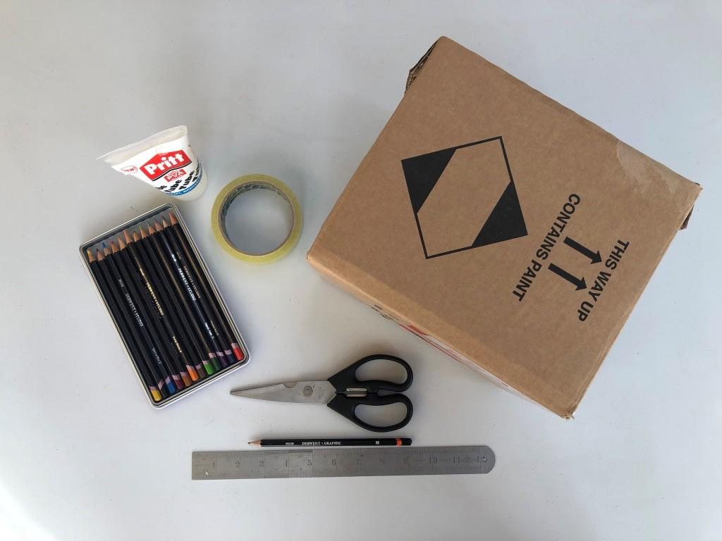 cardboard box, glue, tape, scissors, ruler, pencil, colouring pencils