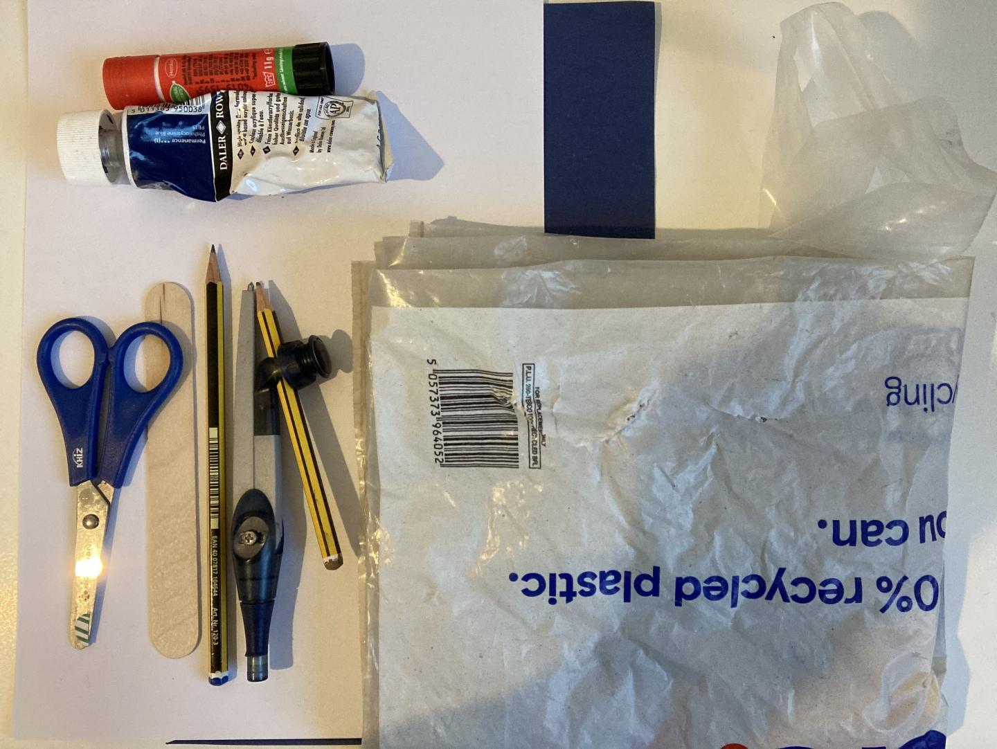(Source of materials e.g. scissors, pencils, plastic bag, paint, glue picture)