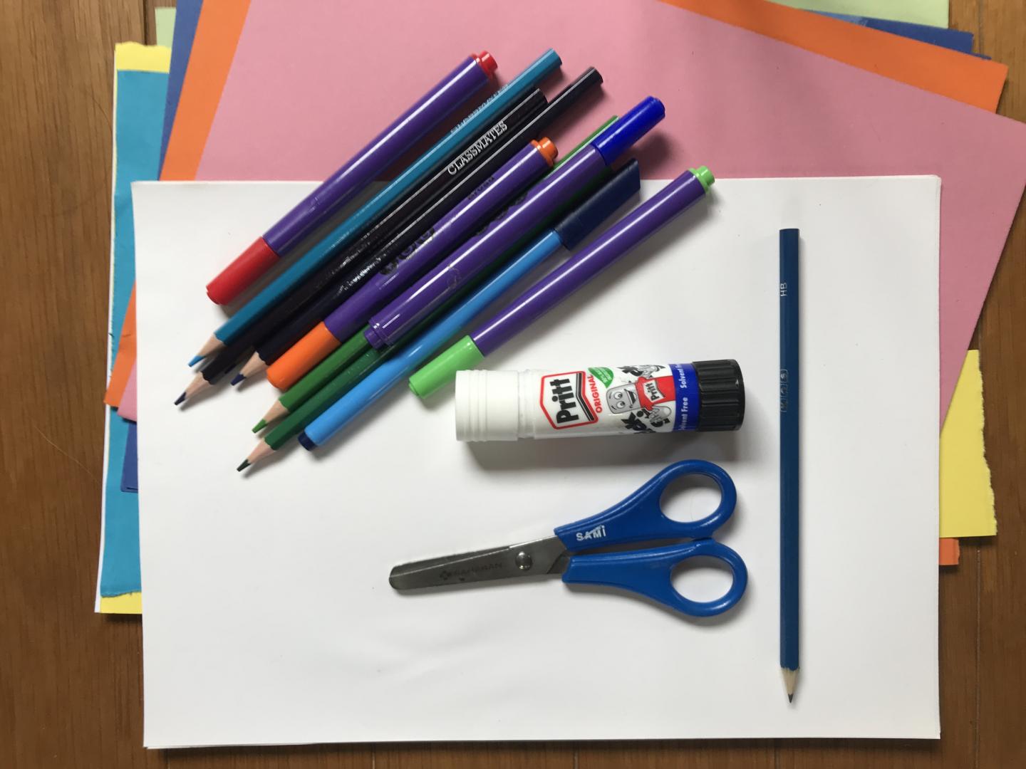 (Source of scissors, felt pens glue and colorful papers picture)
