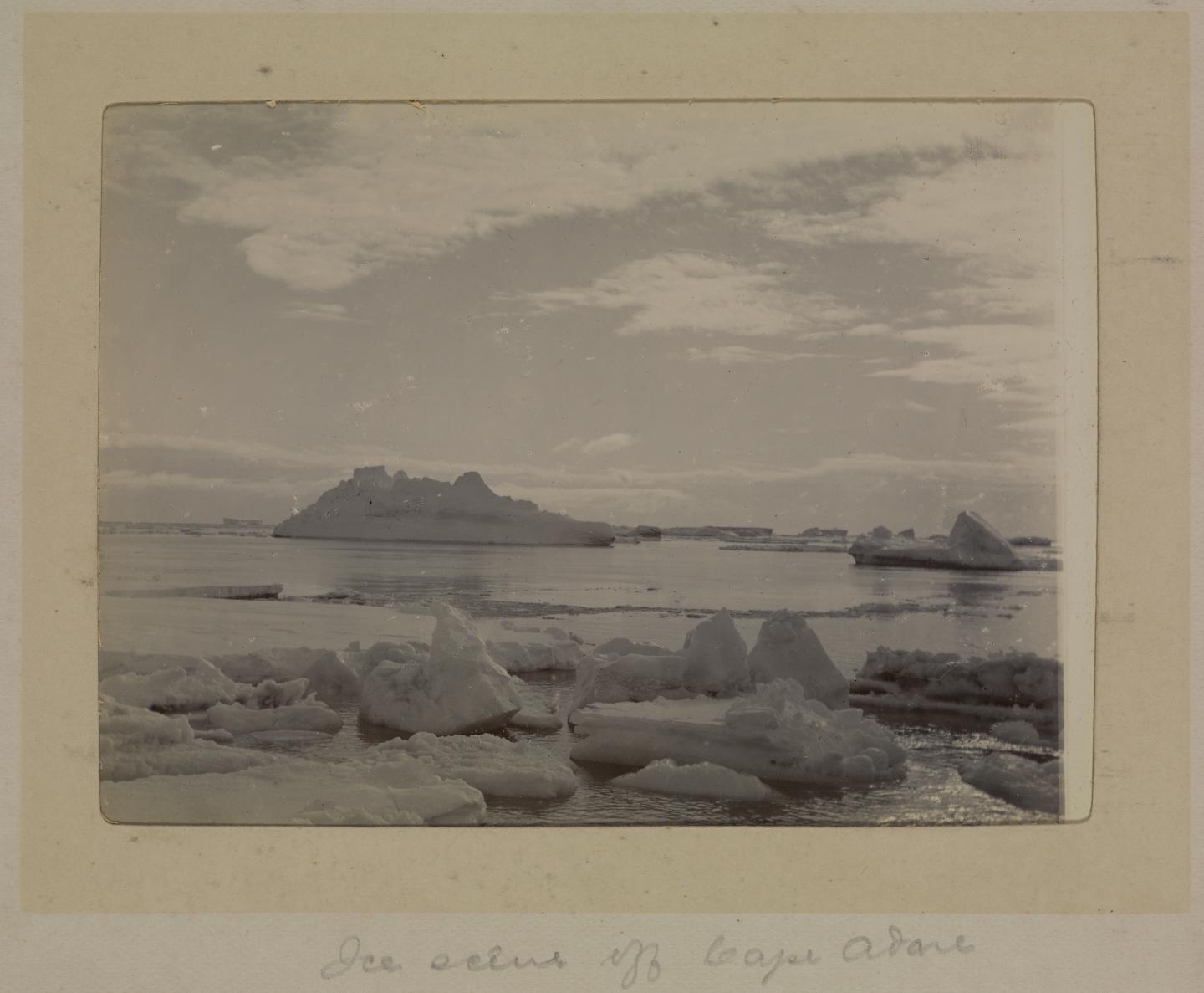 Photograph of icebergs surrounded by water