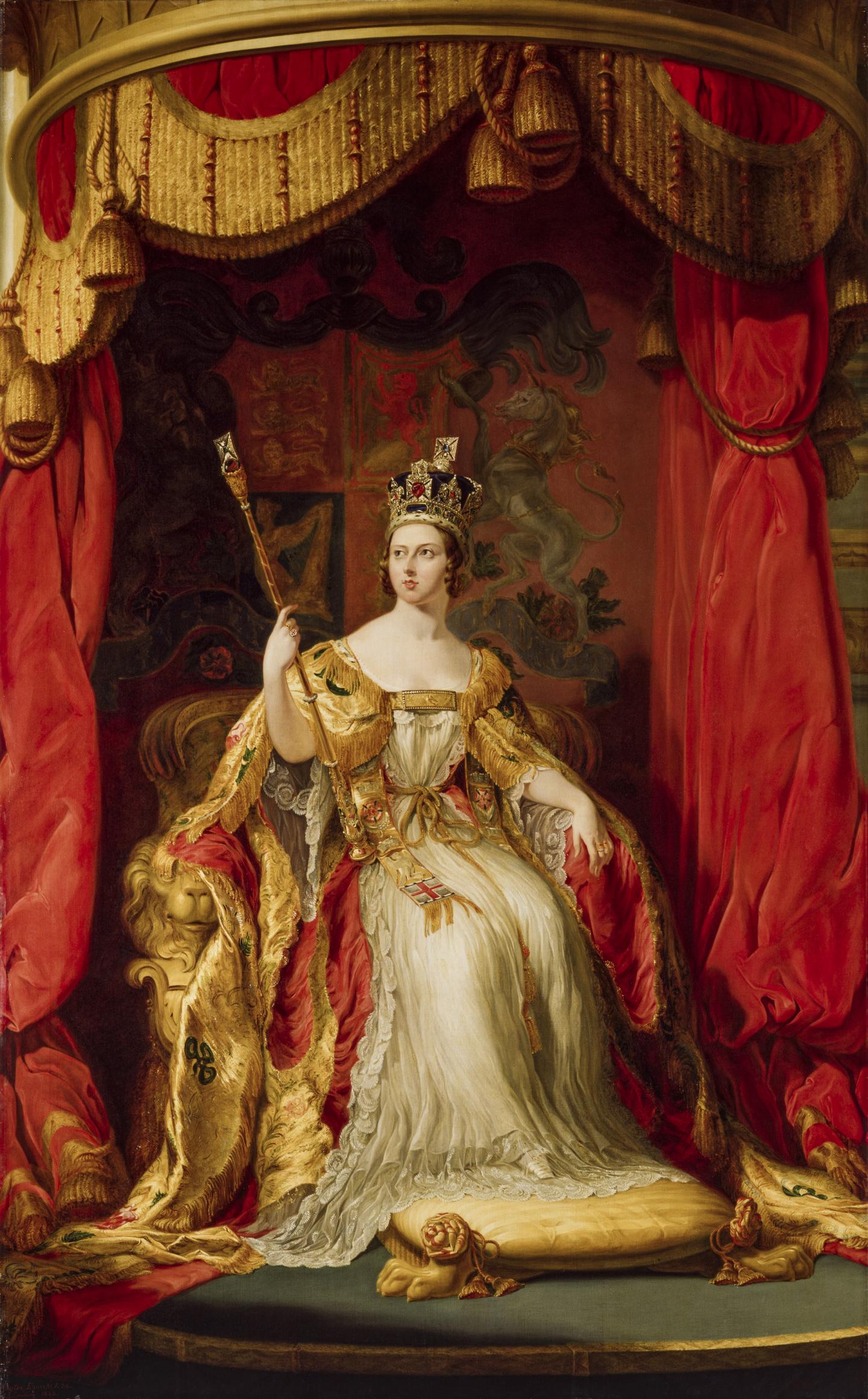 Queen Victoria sits on a throne wearing coronation robes