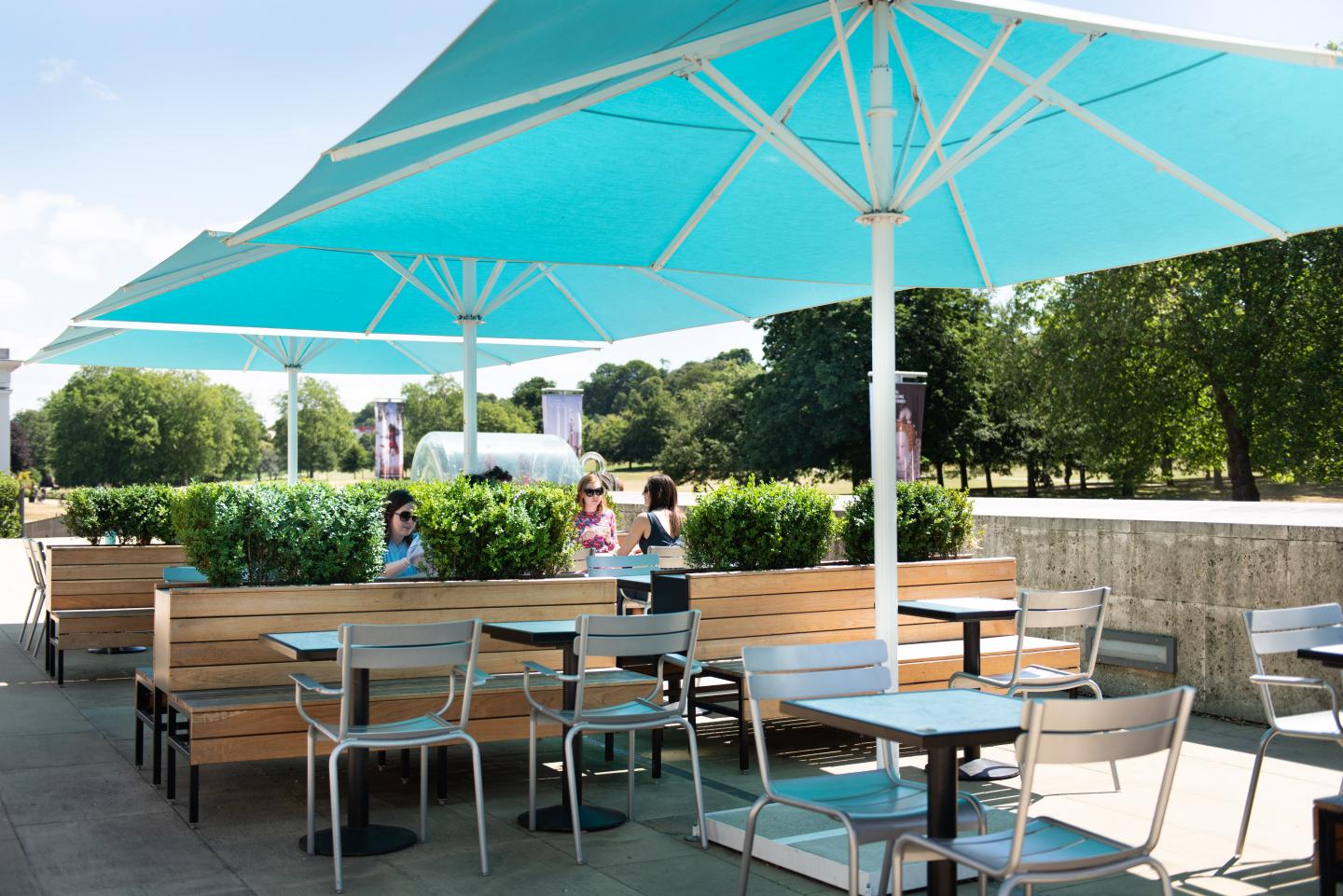 A view of the outdoor tables in the National Maritime Museum's cafe next to Greenwich Park