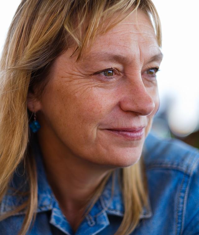 Photograph of Jo Graham. Jo is a white woman with blonde, shoulder length hair. 