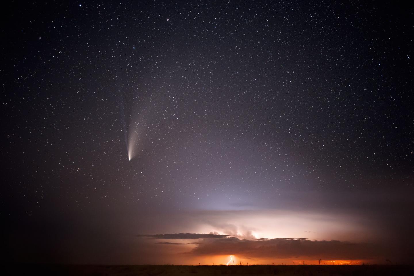 Image of a comet getting close to earth during a thunderstorm