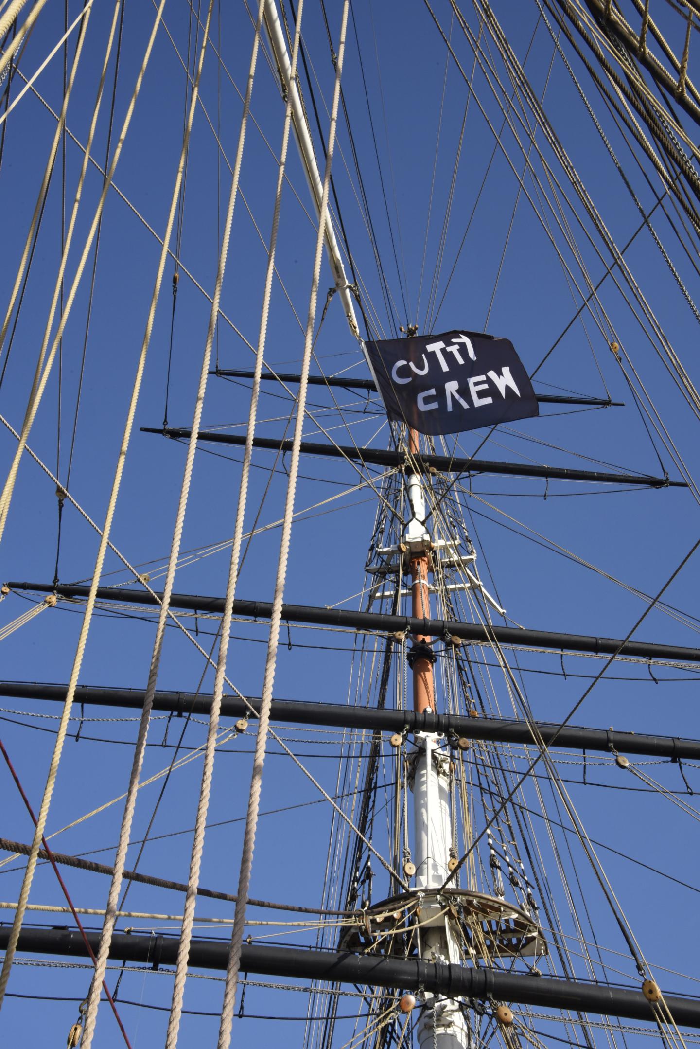 Flag on the Cutty Sark that reads Cutty Crew