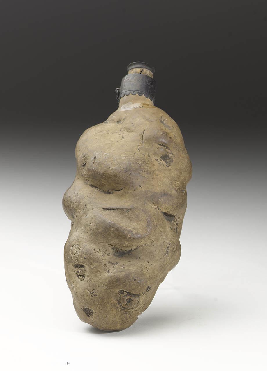 An earthenware spirit flask irregularly shaped like a potato from 1783