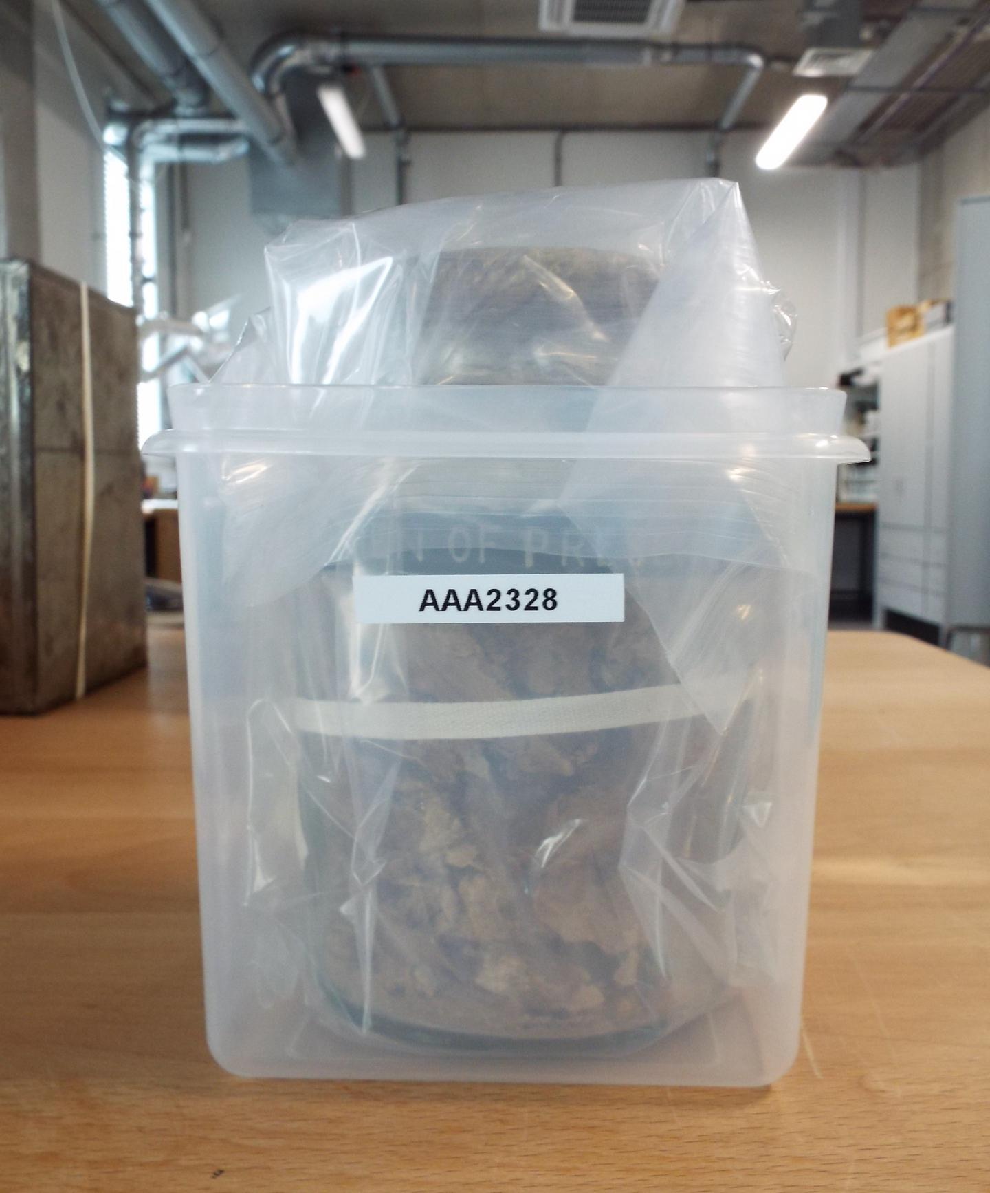 Jar of preserved meat sealed in a bag and in its new box.