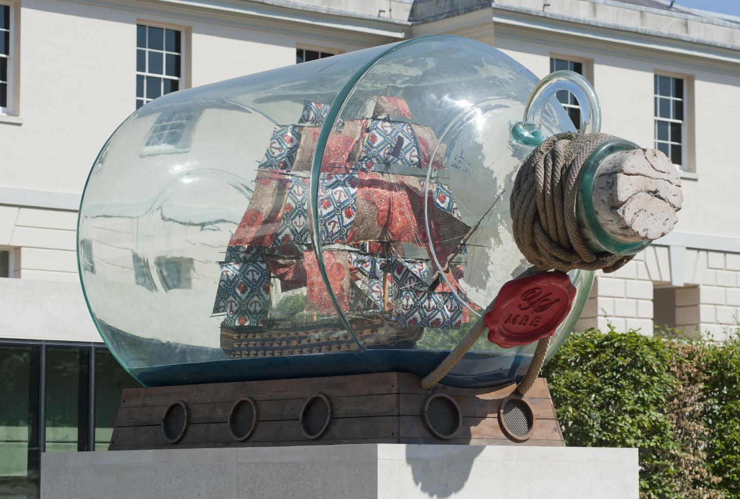 A model ship in a glass bottle in front of the National Maritime Museum.