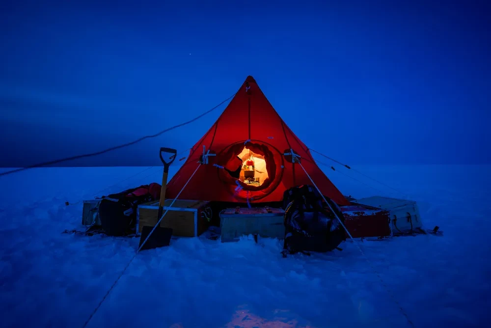 An image from the Exposure: Lives at Sea exhibition depicting a tent in Antarctic