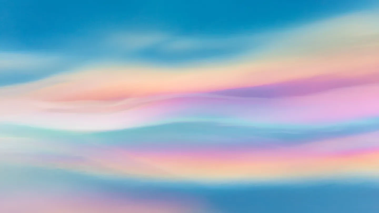 Blue, purple and orange iridescent clouds blur and streak