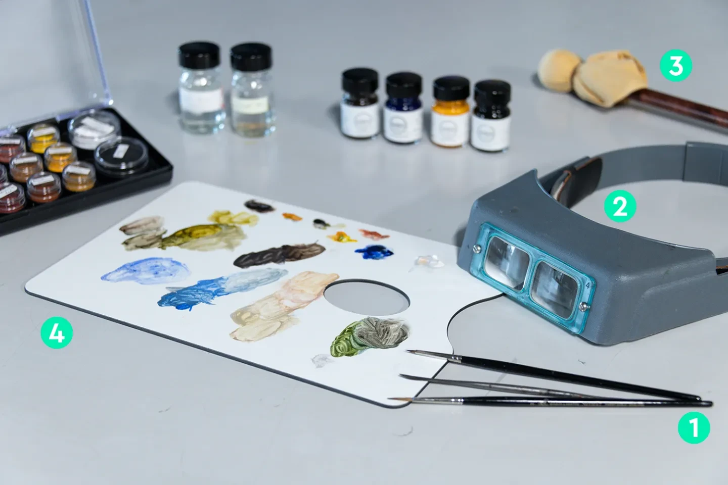 A table of materials and equipment used during the retouching stage of paintings conservation