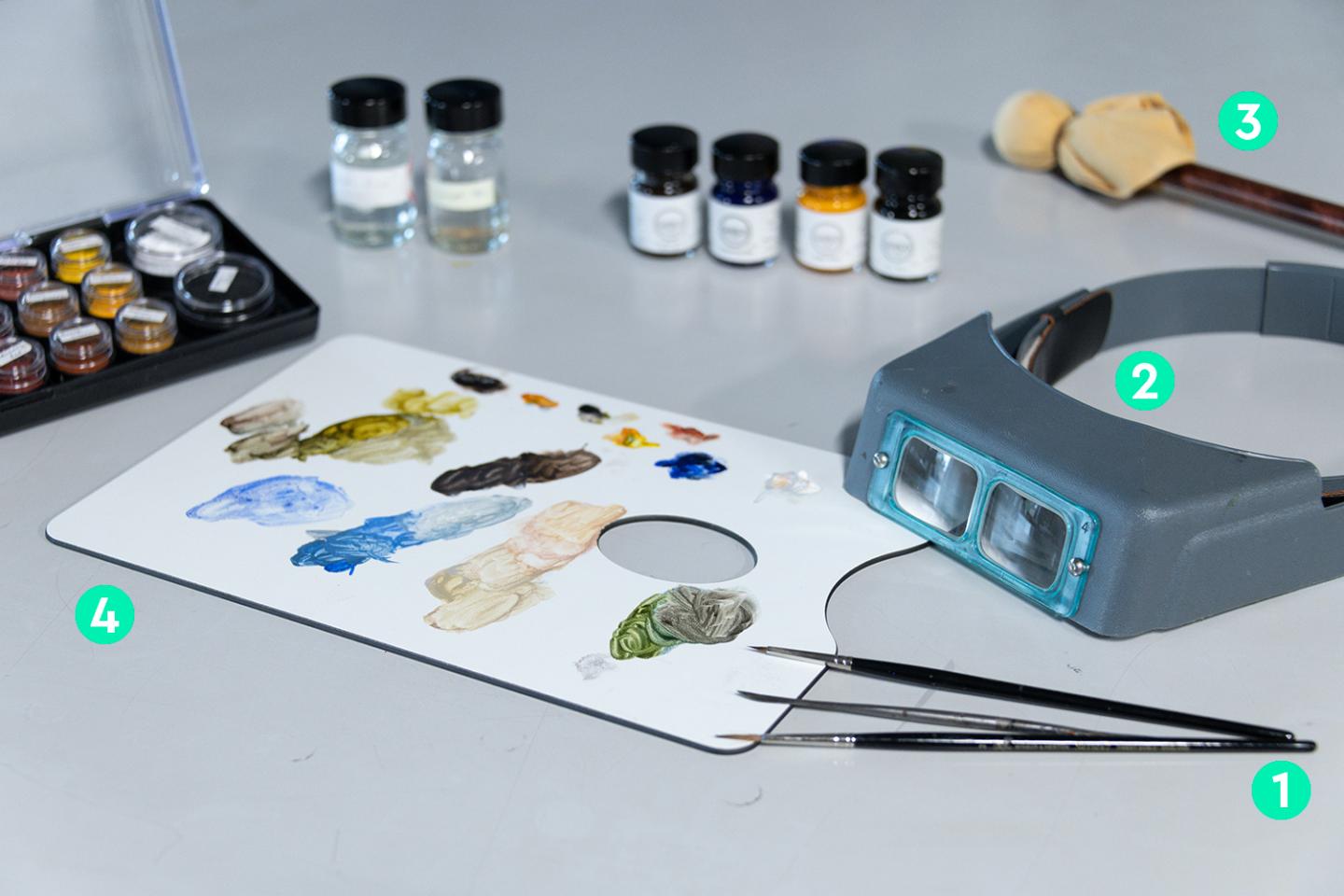 A table of materials and equipment used during the retouching stage of paintings conservation