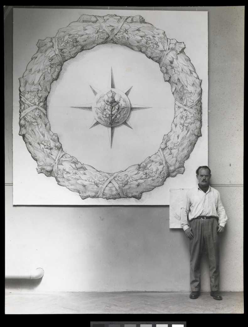 Sculptor Maurice Lambert stands in front of his design for the Merchant Navy memorial at Cutty Sark