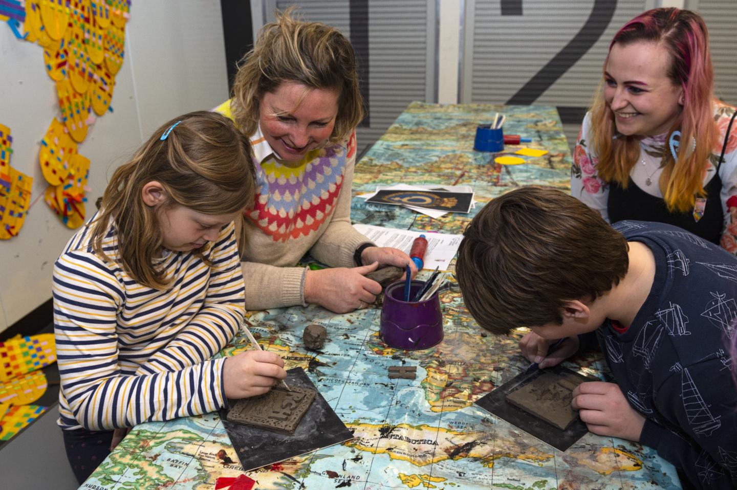Family participating in a craft activity.