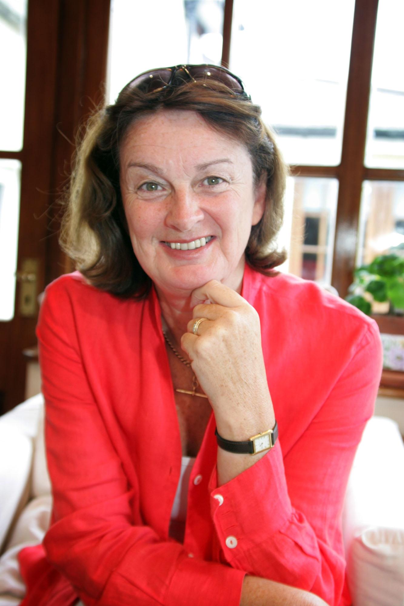 brown haired woman smiling to the camera