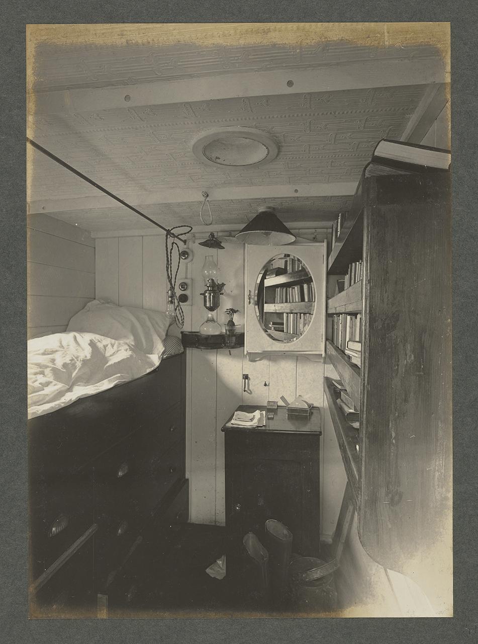 Black and white historic photograph of Sir Ernest Shackleton's cabin on board Quest, the ship he travelled on during his last expedition