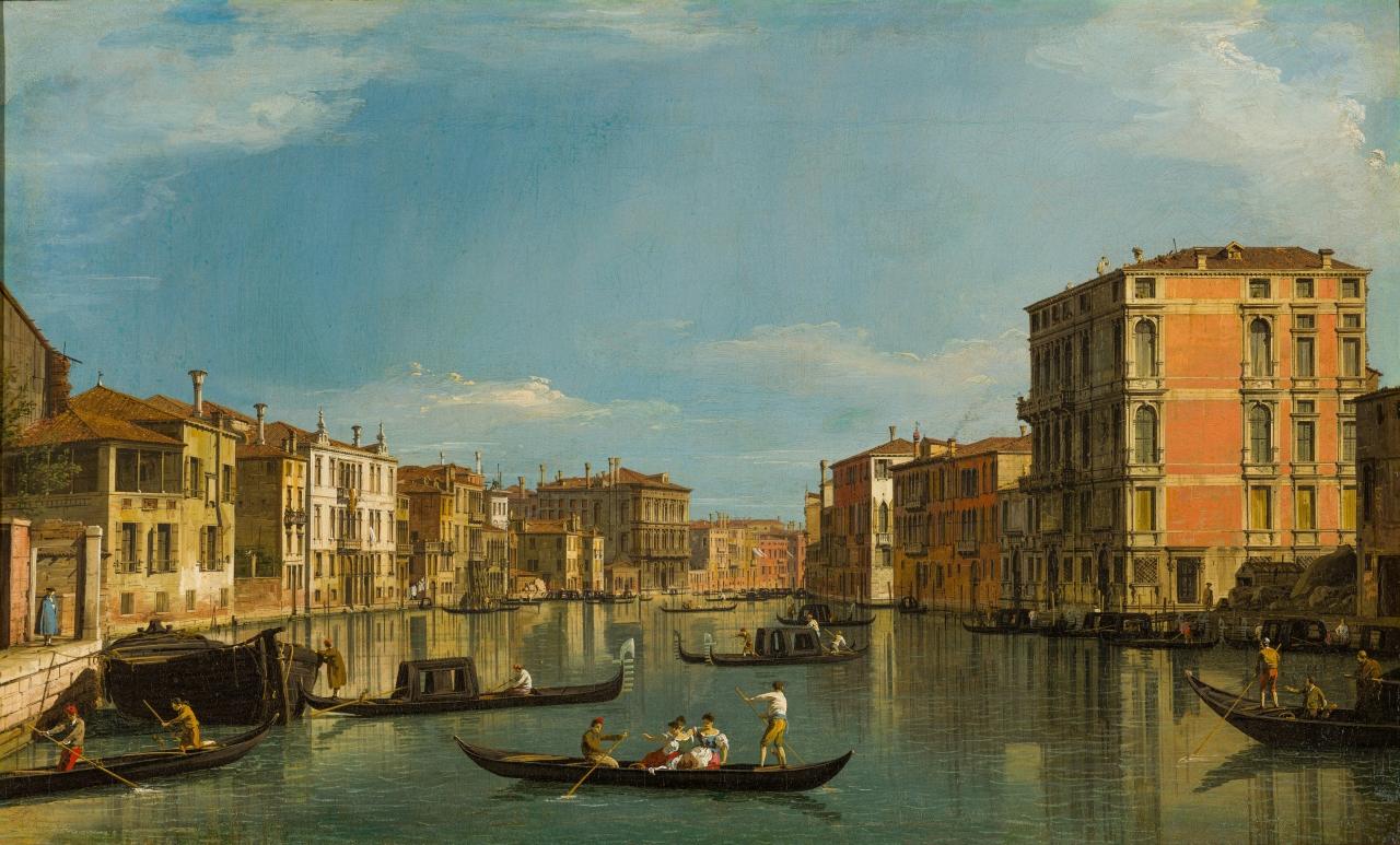 A painting of the Grand Canal in Venice by Canaletto. Gondolas dominate the foreground, with palaces and buildings lining the canal