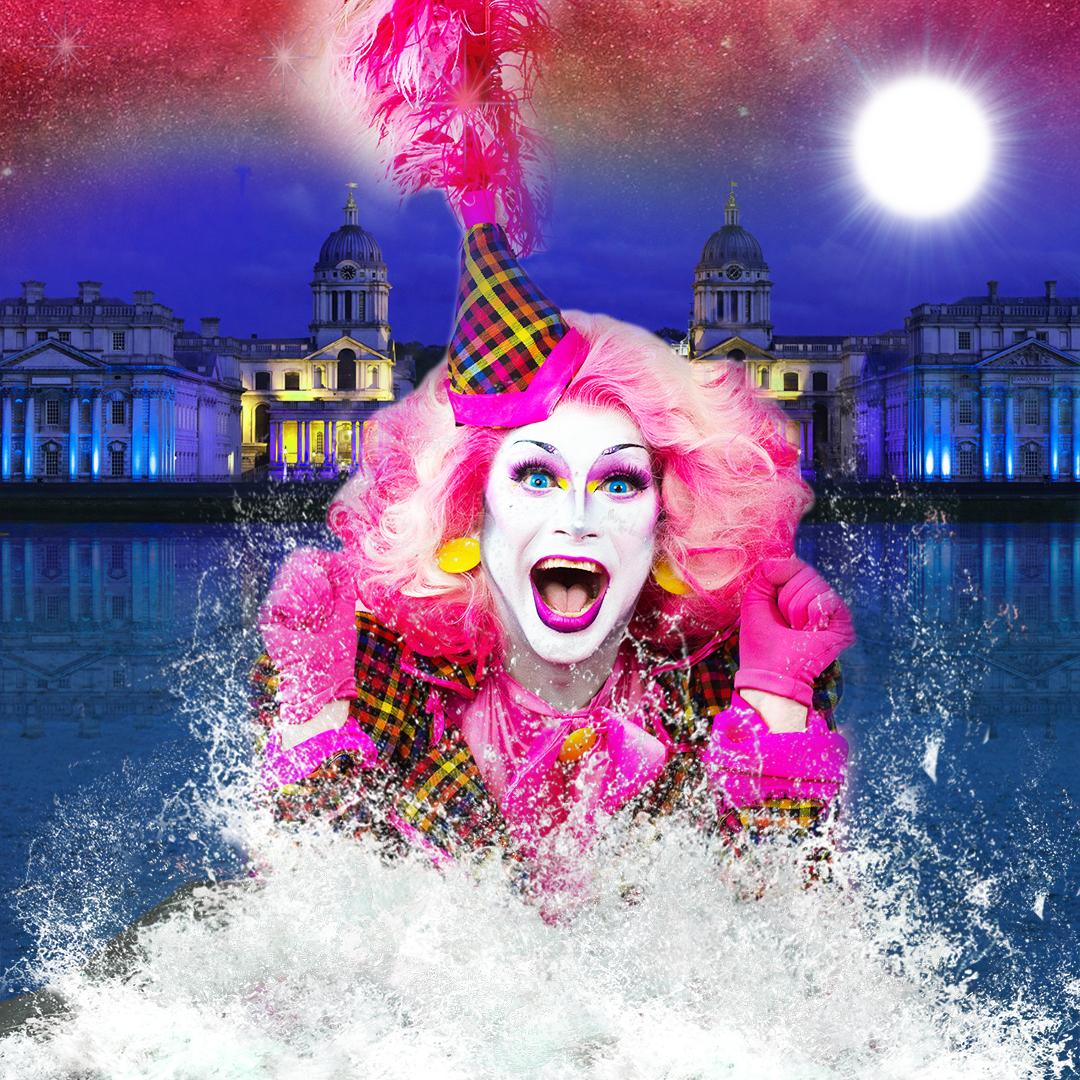 Drag star, Anna Phalactic, is bursting out of the Thames with the Queen's House in the background. Anna is wearing a bright pink wig, a full face of beautiful make-up and a tartan party hat with pink feathers. 