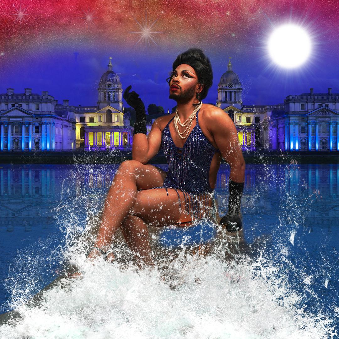 Rhys sits in front of a moonlit background on the River Thames with waves splashing around their feet. They wear a sparkly and suggestive one-piece with an elegant black hair-do, beautiful make-up and long eyelashes. 