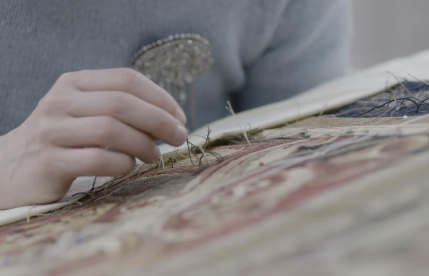 Solebay tapestry conservator close up with needle