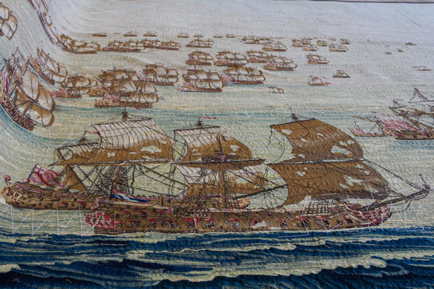 A fleet of sailing ships on a historic tapestry