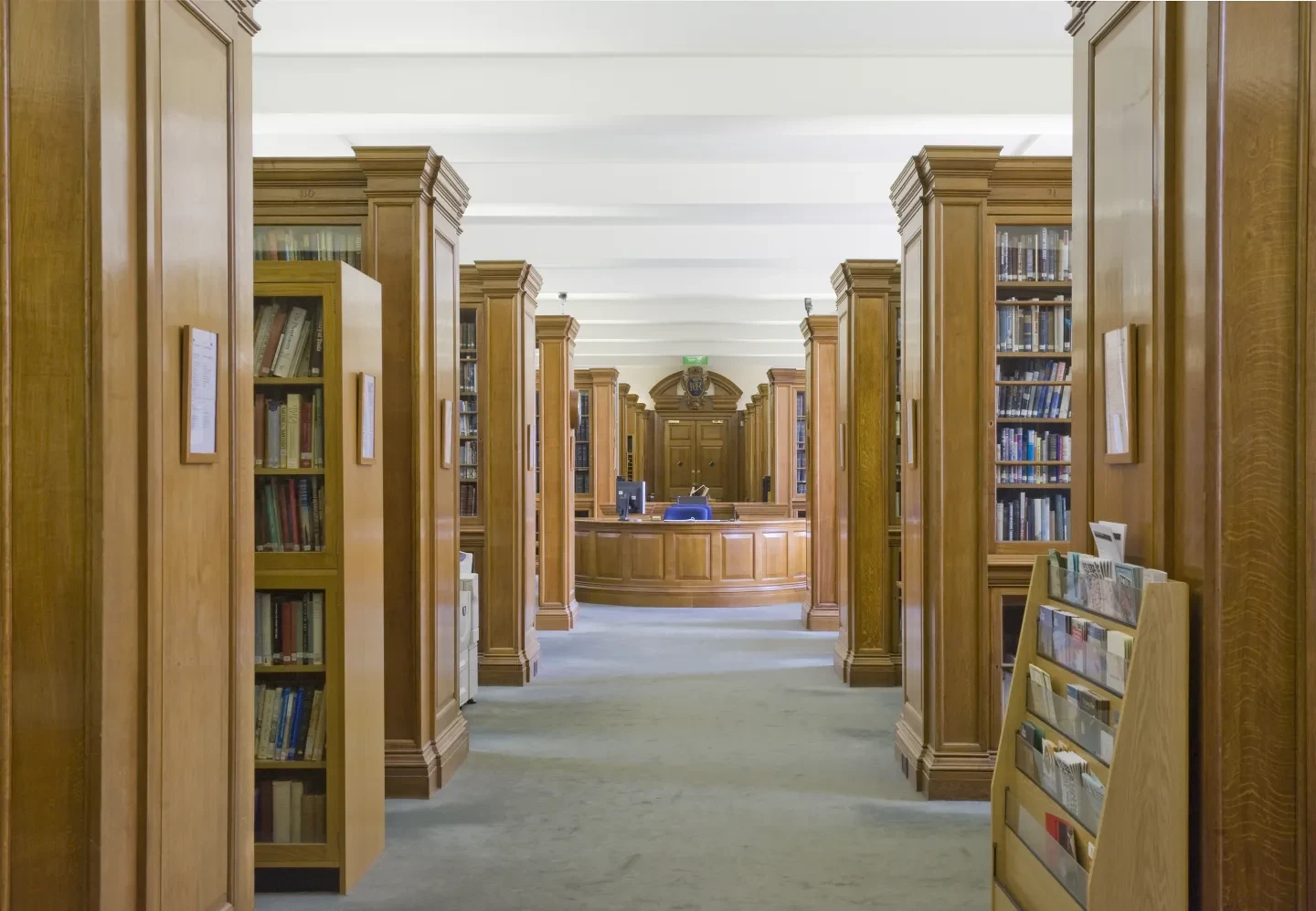 Photograph of bookshelves and a workstation in the library