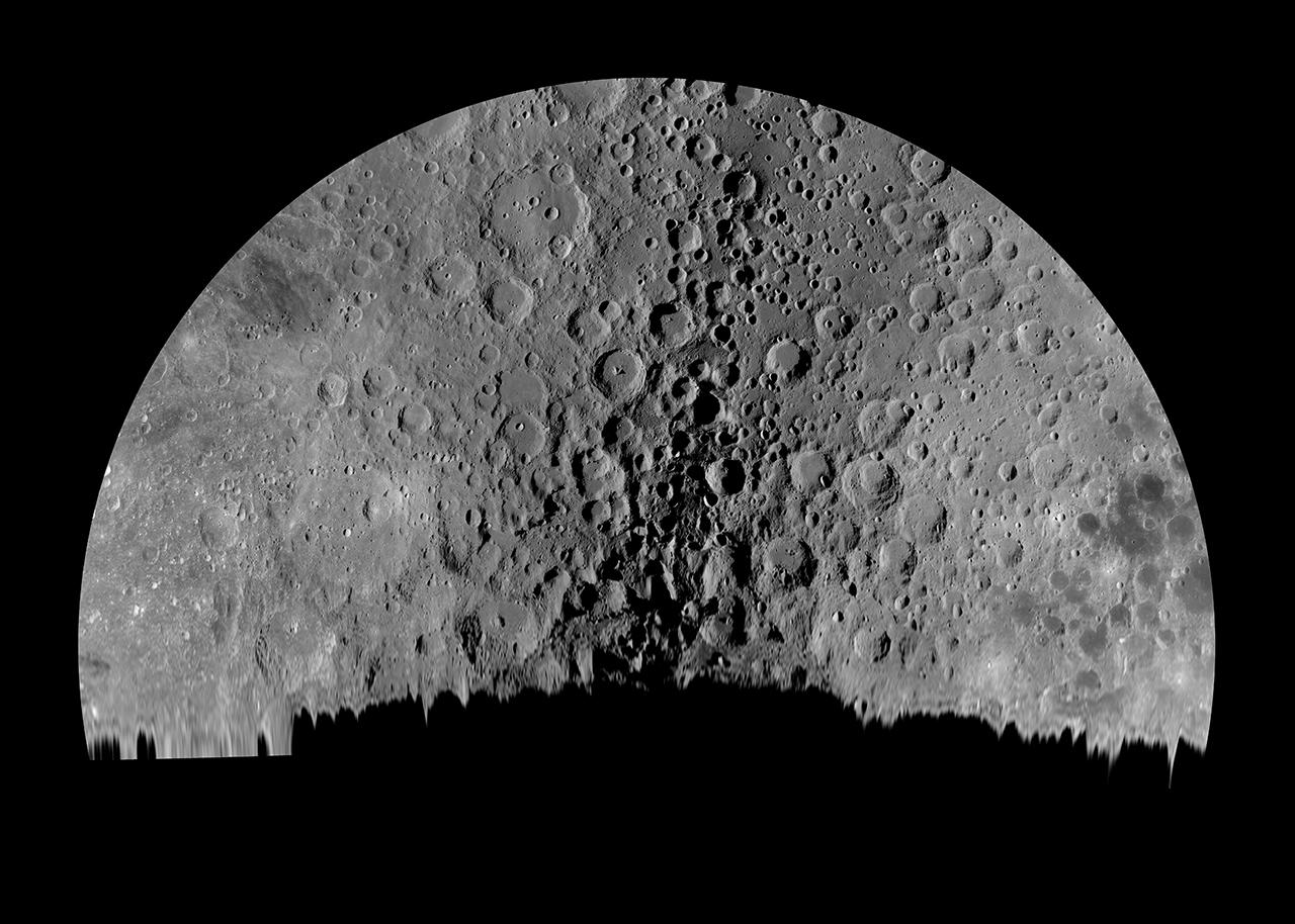 A black and white photo of the Moon, shown as almost a semi-circle with silhouetted objects obscuring part of the surface in the foreground