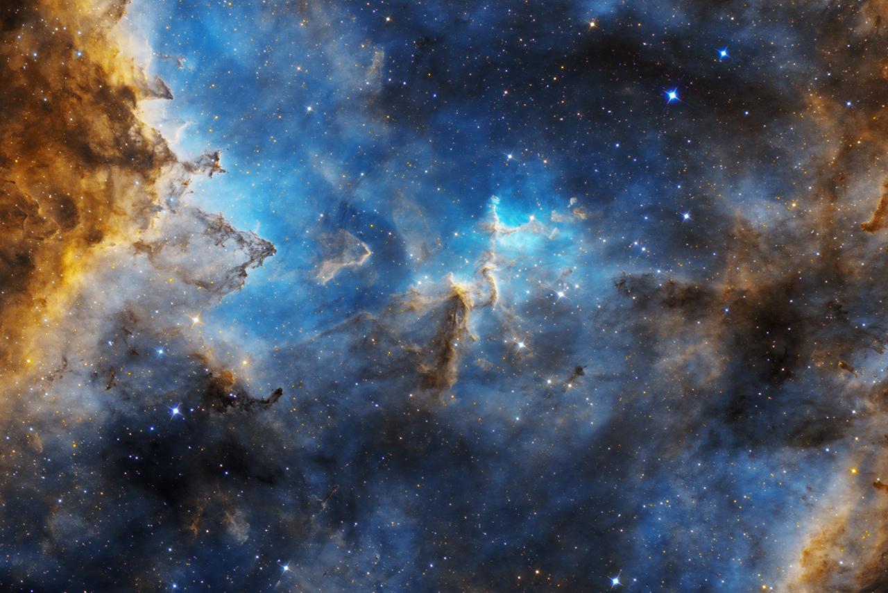 Nebula with clouds of deep blue, light blue, with golden and yellow clouds at the edges