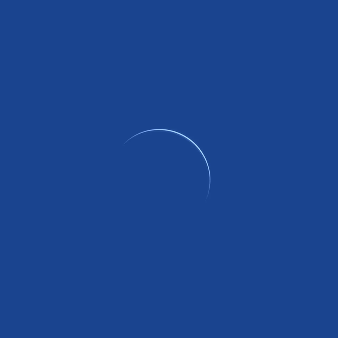 Square image which is completely blue, with a thin semi-circle sliver of white in the middle 