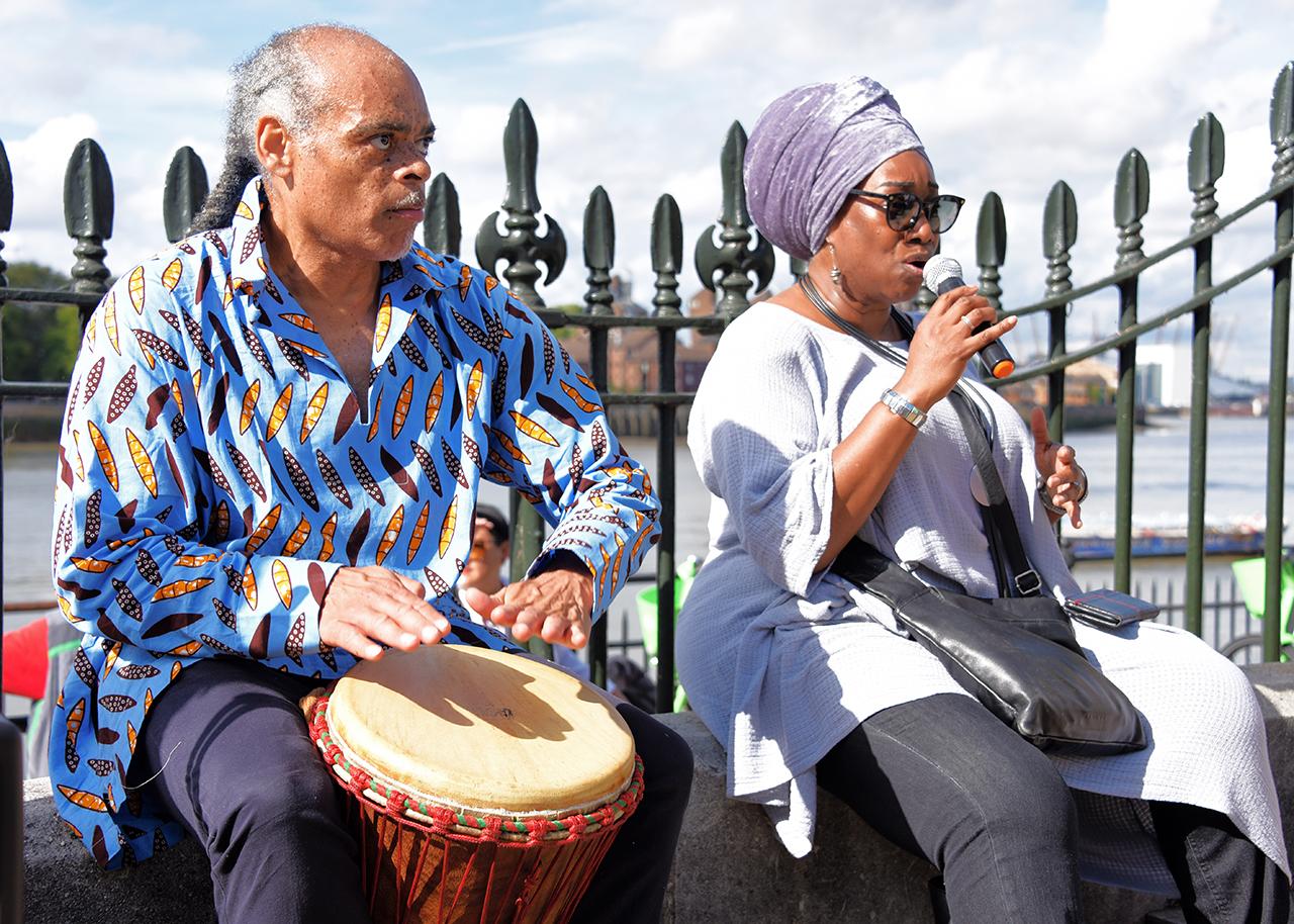 A drummer and singer perform during an emancipation ceremony as part of Slavery Remembrance Day in Greenwich