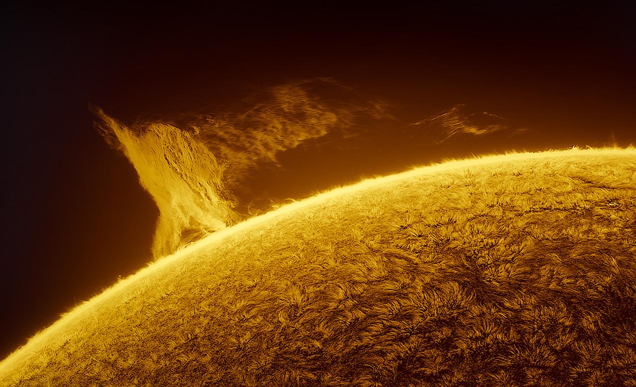 Close up image of the Sun with a giant solar prominence over the Sun's lower atmosphere