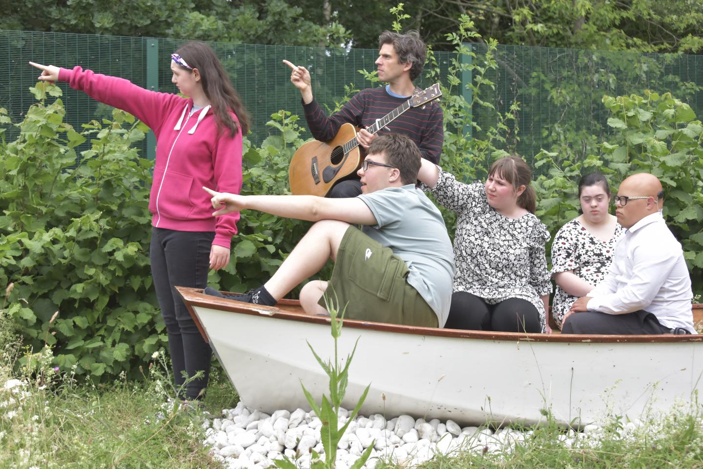 Members of the Sensory Social Club having fun in a boat