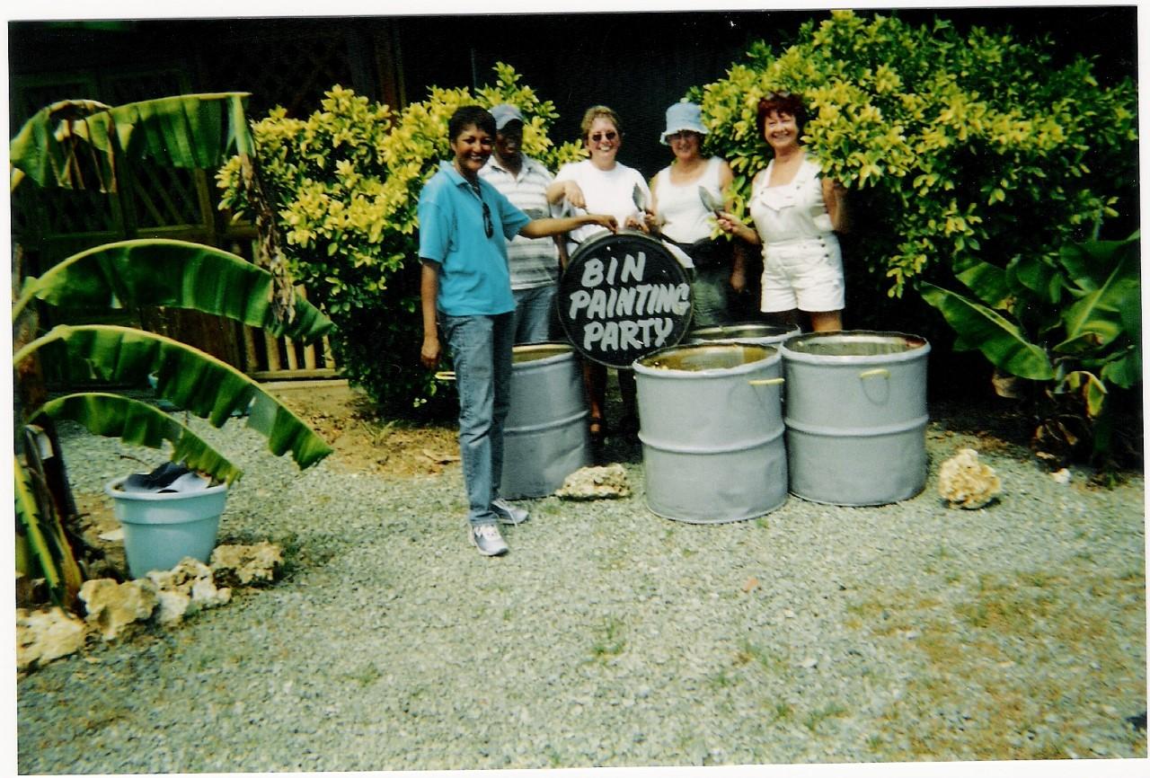 Group of women with painted oil drums