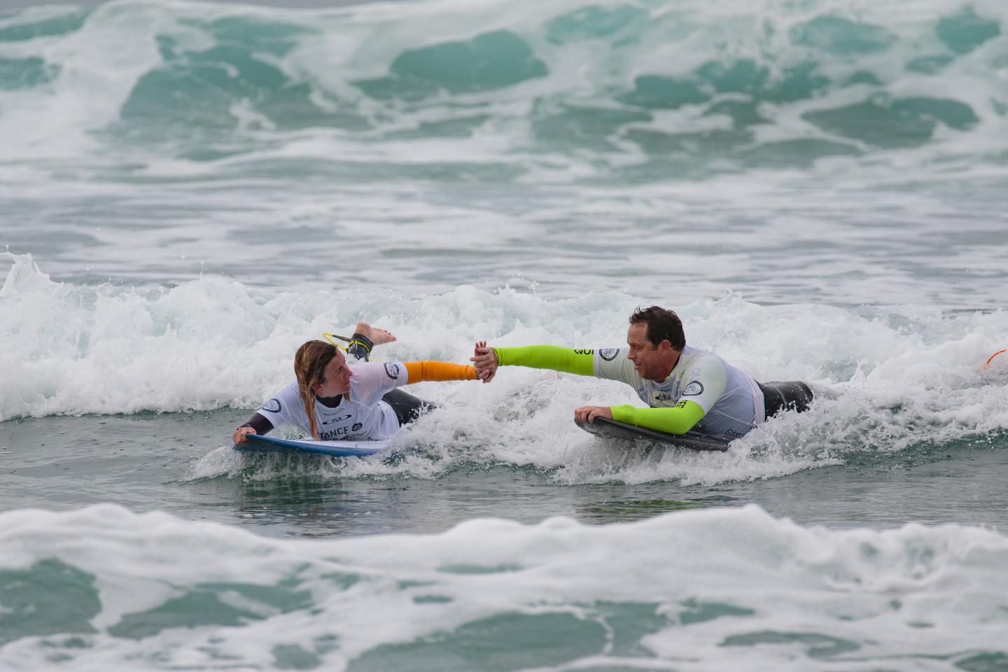 Melissa Reid and guide Matt Harwood in the waves