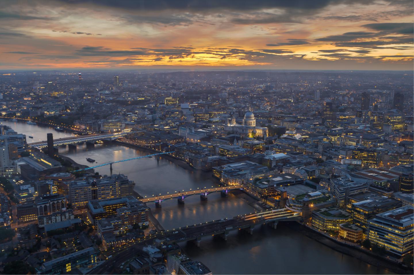 Aerial image of River Thames and bridges at dusk