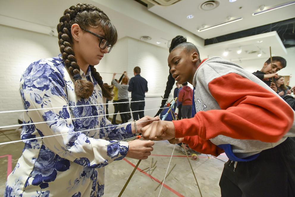 Two young people make an artwork