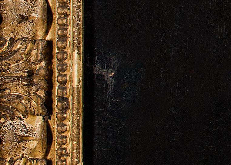 A close-up view of a painting in need of conservation. What appears to be flaking paint can be seen in the dark background of the work, and the gold frame to the left is tarnished