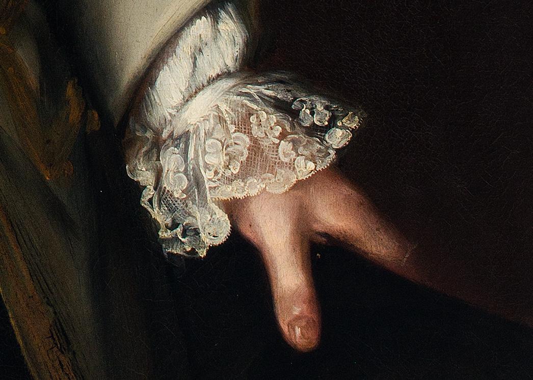 A close-up view of an oil painting, showing a left hand outstretched and a delicate lace cuffs