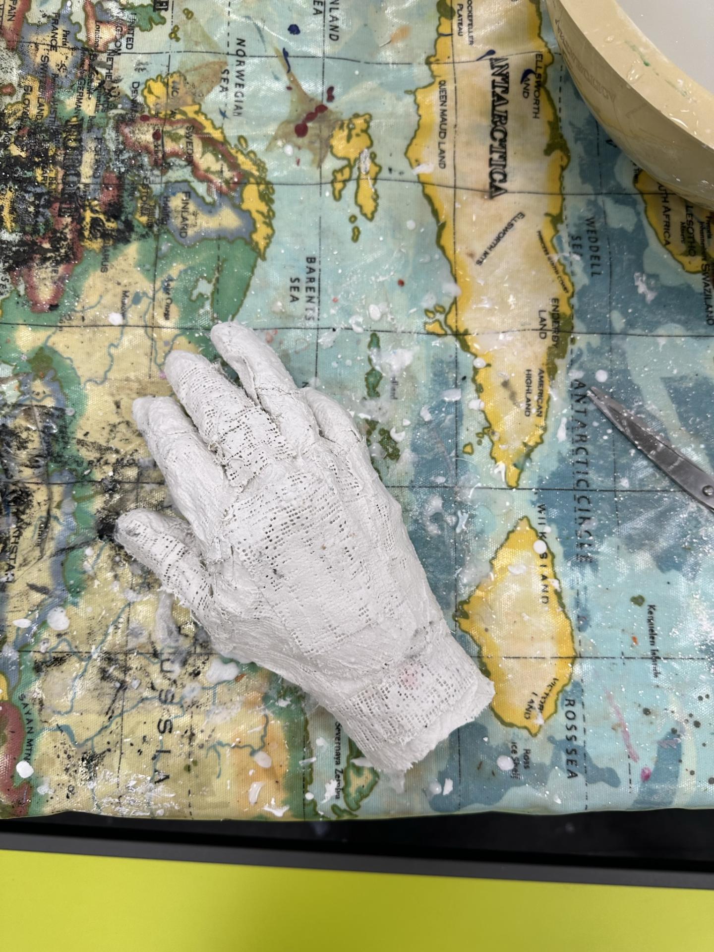 plaster cast of hand on mao