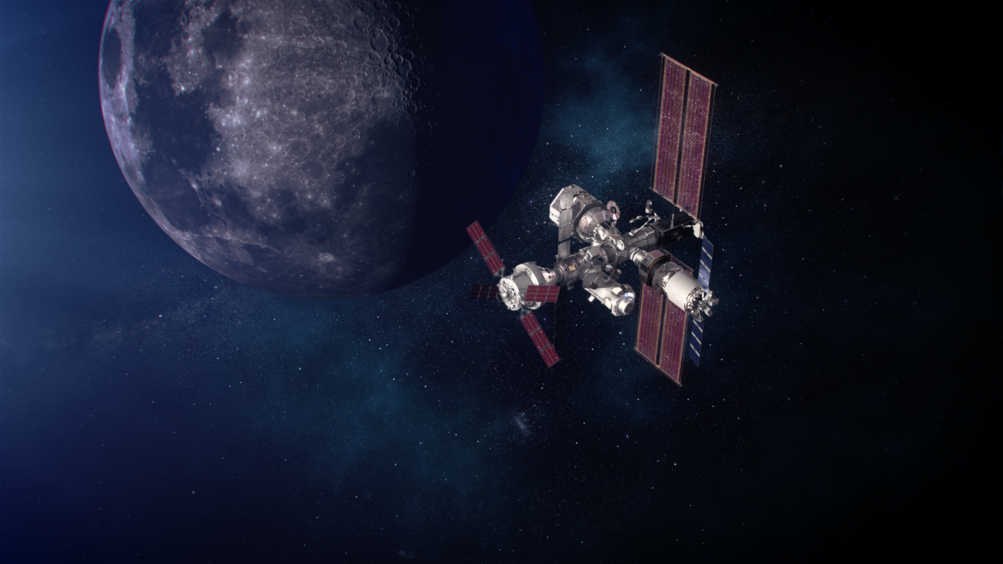 A computer rendered image of the Moon in the distance, with a space station with multiple modules in the foreground, depicting the Lunar Gateway
