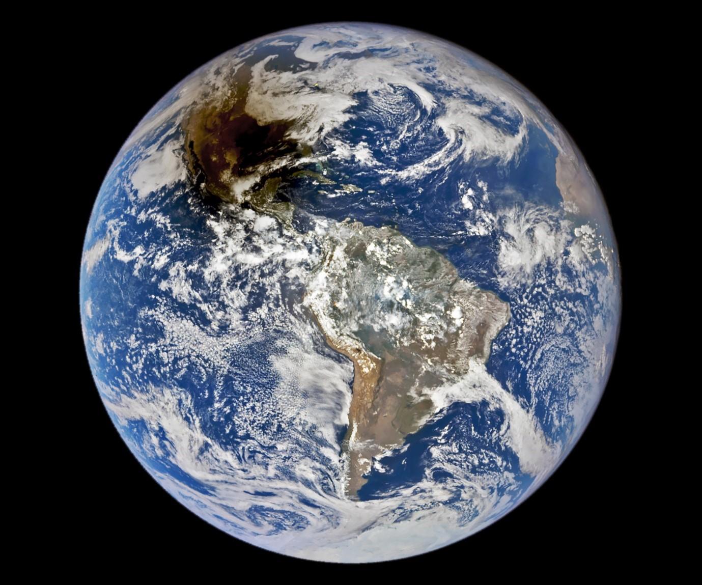 A view of Earth taken from Space with the Moon’s shadow cast upon it.